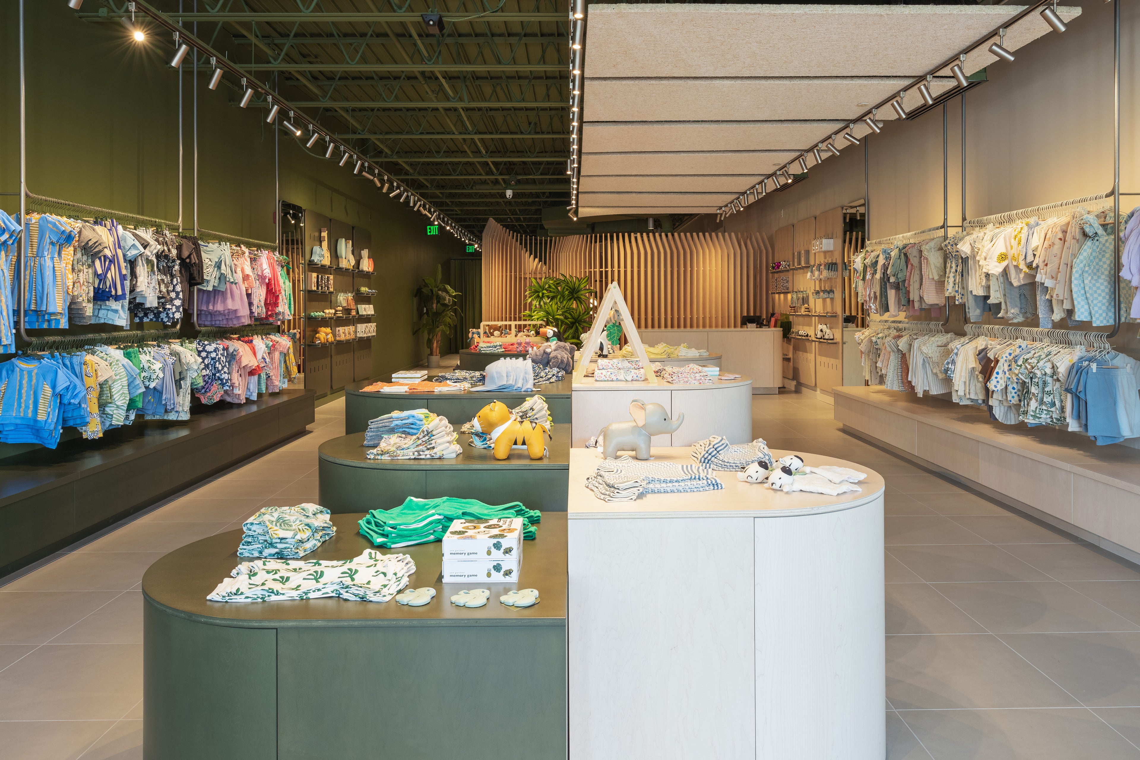 a look inside wild plains retail store. children's clothes and toys displayed neatly on racks and tables